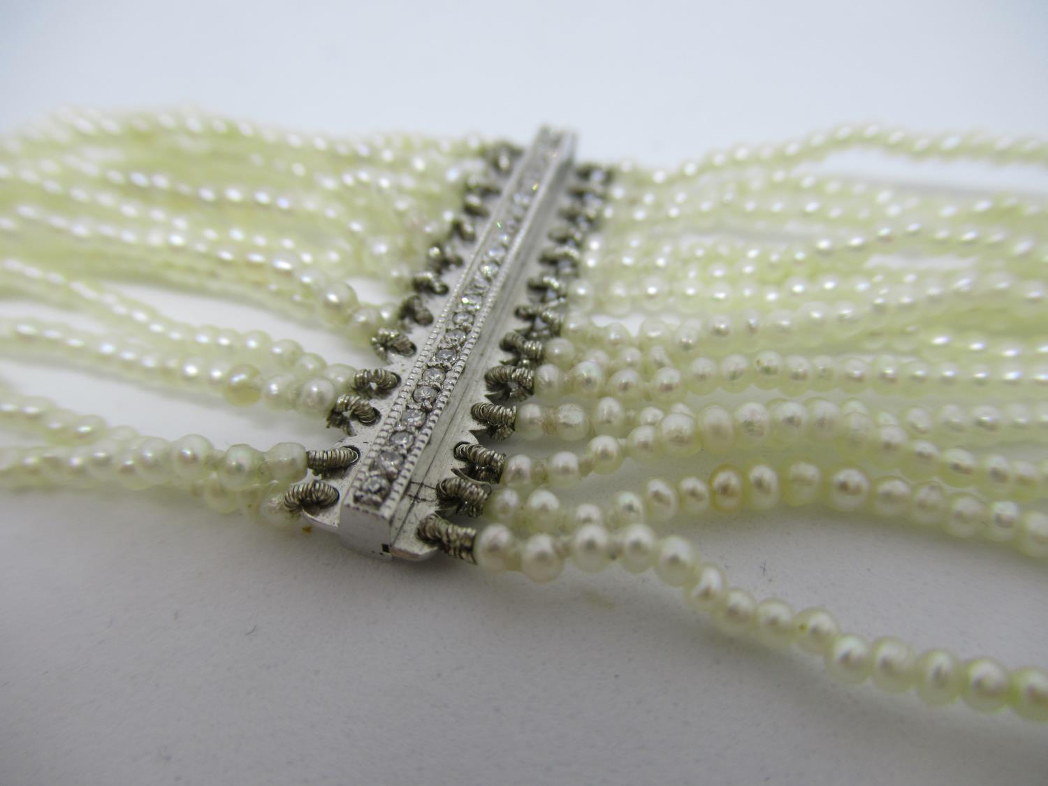 1920's French thirteen row seed pearl choker with diamond set platinum spacers Overall length 31cm - - Image 3 of 3