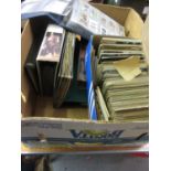 Box containing a large quantity of various postcards in albums and loose and an album of cigarette