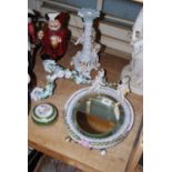 Late 19th Century Continental porcelain oval wall / table mirror with cherub surmount, 14ins high