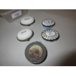 Two antique enamel motto patch boxes, two enamel pill boxes and a pewter trinket box
