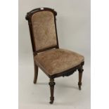 Set of four Victorian carved walnut and ebonised dining room chairs with upholstered backs and seats