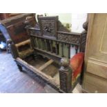 19th Century Continental oak upholstered settle, the carved panel back with bobbin supports raised
