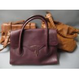 Three various ladies designer style handbags