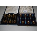 Cased set of six Continental silver gilt enamel decorated coffee spoons, together with a cased set