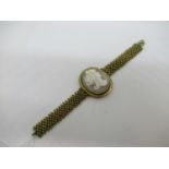 Gilt metal cameo bracelet with integral articulated strap