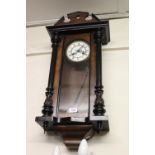 Small 19th Century Vienna type walnut and ebonised two train wall clock The movement is currently