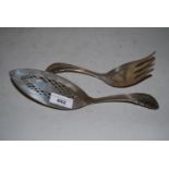 Pair of Georg Jensen silver fish servers with pierced decoration and decorative handles (at fault)