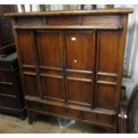 19th Century Korean elm side cabinet, the panelled front with two doors above three small drawers