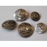 Set of five white metal buttons bearing a crest in the form of a gauntlet and scales