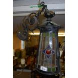 Art Nouveau oxidised and copper leaded glass hall lantern with integral wall bracket, 16.5ins high