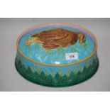 19th Century George Jones oval Majolica tureen and cover, the cover mounted with a figure of a