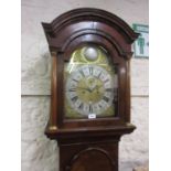 Figured walnut longcase clock, the broken arch hood with flanking pilasters above a moulded panel