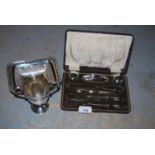 Cased silver mounted part manicure set, small silver trophy cup and a small rectangular plated