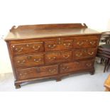 Late 18th Century oak mahogany crossbanded mule chest, the hinged lid above three dummy drawers,