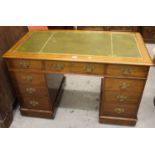 Small 19th Century mahogany twin pedestal desk, the moulded green tooled leather inset top above