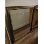 Large 20th Century gilt framed rectangular wall mirror with bevelled plate, 42ins x 55ins (at fault)