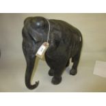 Large antique ebony figure of an elephant (at fault, lacking ears, tusks etc.), 15ins high