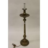 Late 19th / early 20th Century brass candle stand with drip tray and tapering faceted column (