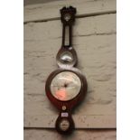 19th Century rosewood wheel barometer with silvered dials