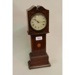 20th Century mahogany inlaid mantel clock in the form of a longcase clock having circular paper dial