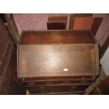 Small 18th Century oak bureau, the fall front enclosing a fitted interior with well above two