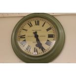 Large circular green painted metal wall clock, the painted dial signed Pul-Syn-Etic Gent and Co