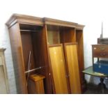 20th Century cherry and fruit wood four door breakfront wardrobe, the moulded cornice above four