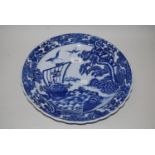 20th Century Japanese circular blue and white charger decorated with figures in a sailing boat in