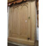 19th Century pine side cabinet with a single Gothic panelled door (cuts and alterations), 28.5ins
