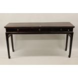 Early 20th Century Chinese hardwood side table with three frieze drawers raised on square tapering