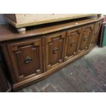 Reproduction American cherry wood sideboard, the moulded top above four panelled doors on a plinth