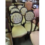 Set of six Victorian walnut dining chairs with carved button upholstered backs, overstuffed seats