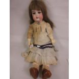Gebruder Kuhnlenz doll with a bisque head, sleeping eyes and open mouth with four teeth on a jointed
