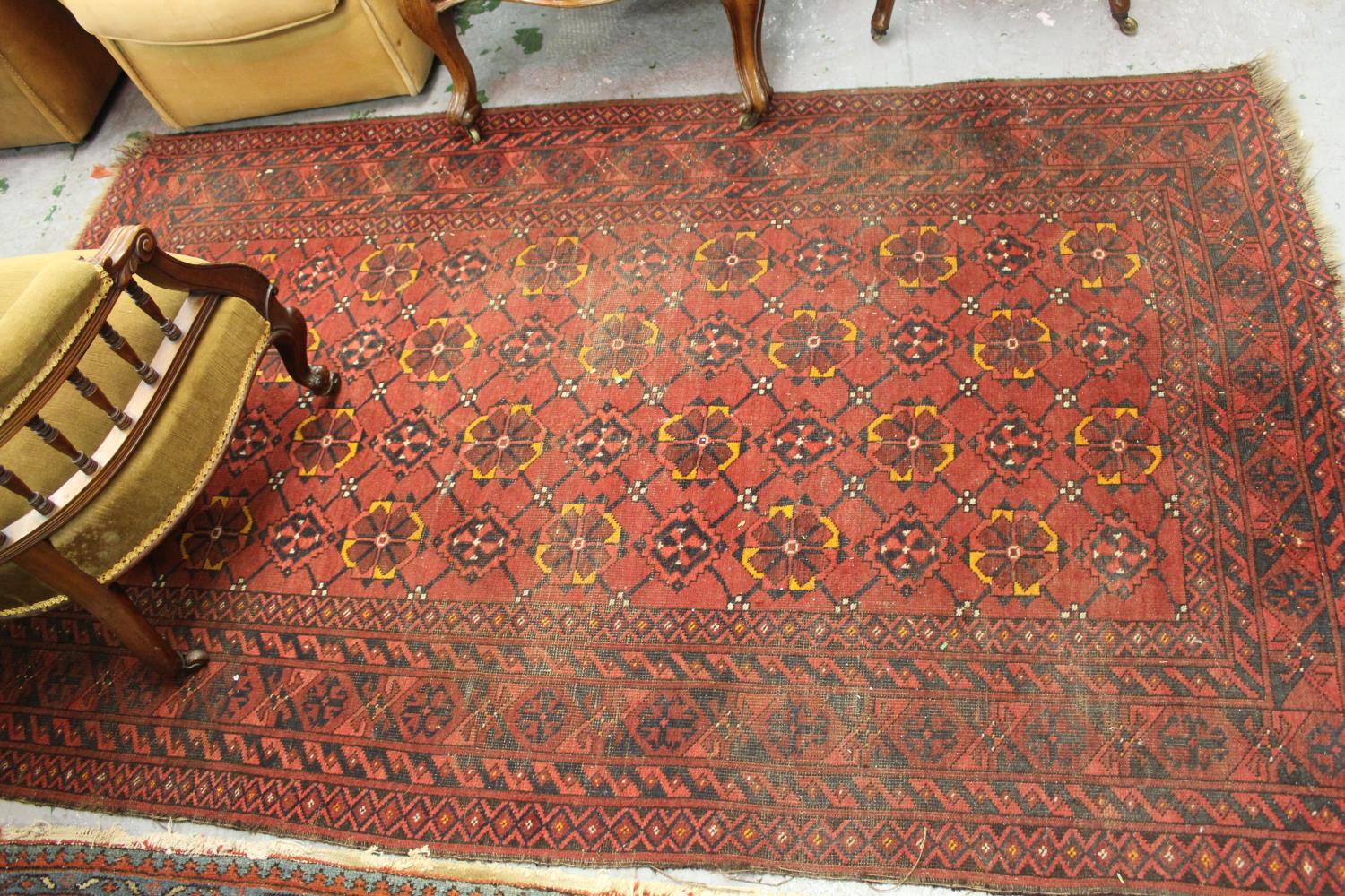 Afghan rug with four rows of twelve gols with multiple borders on wine ground, approximately 84ins x