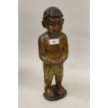 Antique Eastern carved and painted wooden figure of a boy, 18ins high