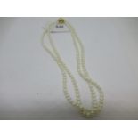 Two row freshwater pearl necklace with ball form 14ct yellow gold clasp