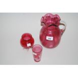 Cranberry glass baluster form vase, similar smaller vase and a Mary Gregory type beaker