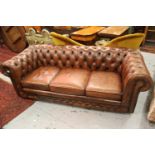 Brown buttoned leather upholstered three seater Chesterfield sofa