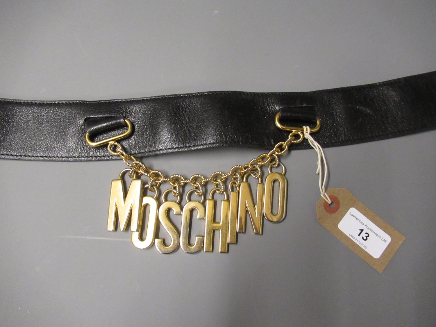 Moschino ladies leather belt with gilt metal hanging logo on chain