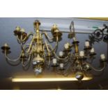 Brass Dutch style ten branch chandelier together with a modern brass chandelier