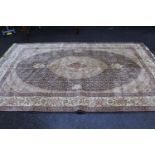 20th Century machine woven rug having all-over floral design with multiple borders on a gold ground,