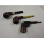 Unusual Bakelite pipe in the form of a pistol, together with two silver mounted pipes