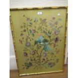 Crewel work picture of birds and flowers in a simulated bamboo frame, 27.5ins x 20.5ins together