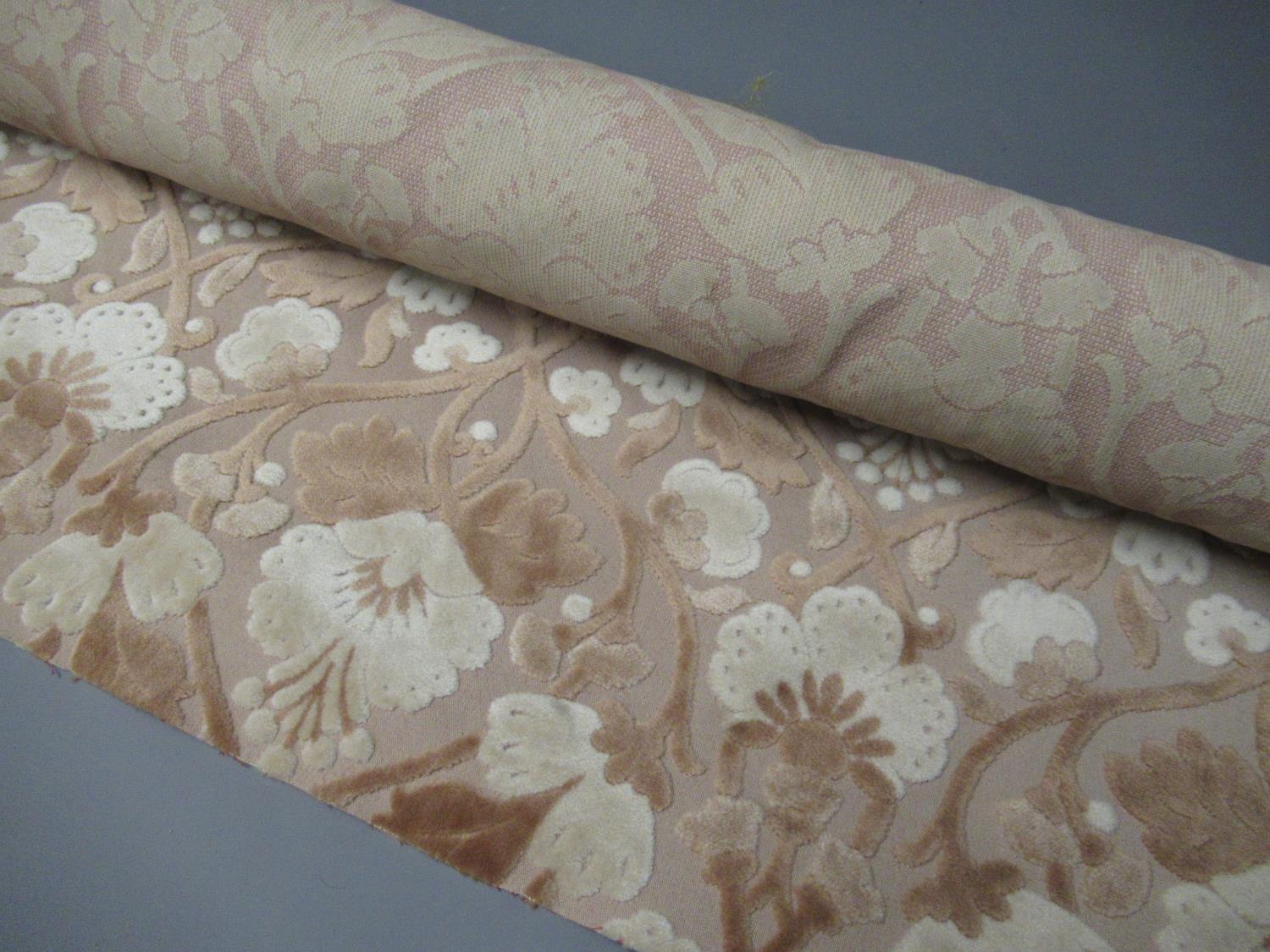 One roll of pink fabric, two boxes containing a large quantity of upholstery / curtain / tapestry