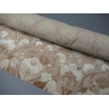 One roll of pink fabric, two boxes containing a large quantity of upholstery / curtain / tapestry