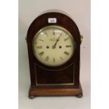 Regency mahogany bracket clock with circular brass side handles, the circular painted dial with