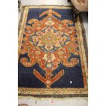 Kurdish rug with lobed medallion design on a royal blue ground with three guard stripes, 6ft x 3ft