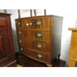 Small reproduction chest of four long graduated drawers with brass handles on cabriole supports