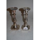 Pair of antique Peurto cast silver candlesticks on square bases
