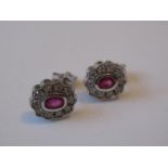 Pair of 9ct white gold diamond and ruby set cluster stud earrings